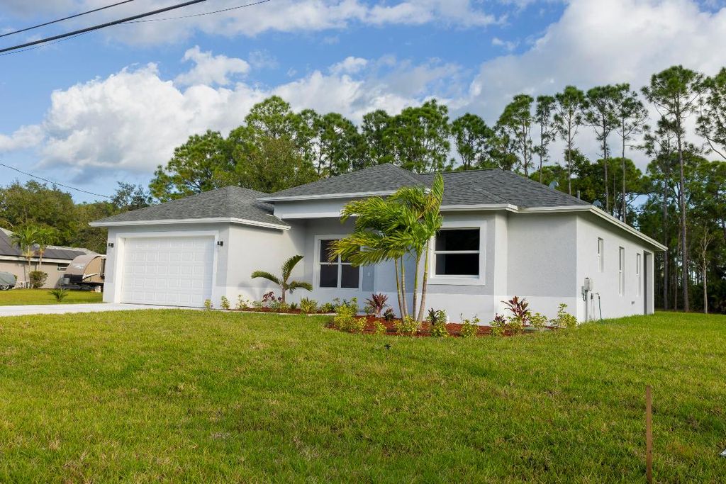 Photo of 6009 NW Wesley Road, Port Saint Lucie, FL 34986 (MLS # R10929909)