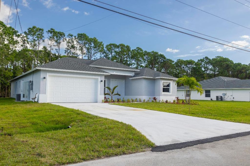Photo of 6009 NW Wesley Road, Port Saint Lucie, FL 34986 (MLS # R10929909)