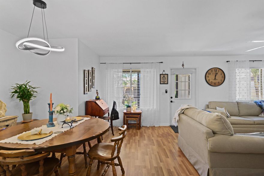 Come see this cozy and recently updated 2-bedroom, 2-bath condo located in a welcoming 55+ community. This charming residence features new wood-like flooring throughout with nicely upgraded bathrooms. Enjoy peace of mind with accordion hurricane shutters,
hurricane-impact sliding doors, and a newer A/C unit. Relax in the enclosed porch overlooking, perfect for morning coffee or evening unwinding. The community offers ample parking, a clubhouse, fitness center, and scenic sidewalks along the water, creating the perfect blend of comfort and lifestyle. Move-in ready and waiting for you to call it home.