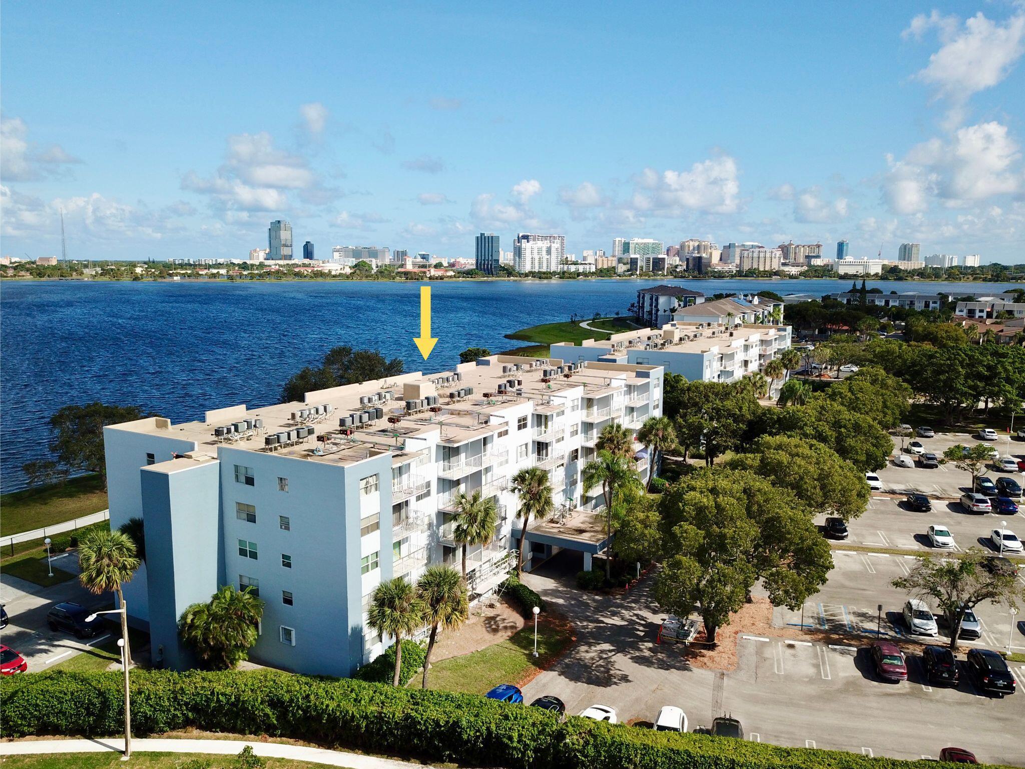 Price Reduced! Exclusive LAKE VIEW unit at Breakwater near downtown West Palm Beach. Seller offering $1,000 credit to the buyer at closing with full price offer-perfect for closing costs or rate buy-down. This all age community boasts location, value and views. Take the elevator up to the 2nd floor, unit 2B, and enter your move-in ready 1-bedroom 1-bathroom condo with epic views of Clear Lake and the West Palm Beach city skyline from your private balcony! Kitchen has granite countertops, modern cabinetry, and a convenient pass-thru. Plantation shutters, a spacious walk-in closet, and wood laminate flooring. Pet friendly, 1 dog or 1 cat <20lbs. Breakwater community amenities include; pool, sauna, tennis courts, BBQ area, clubhouse, car wash area & gym. Minutes to everything!