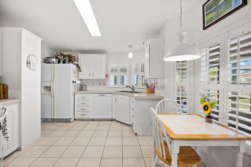 Charming Beachcomber model offering 2 spacious bedrooms, 2 baths, a formal dining room along with an eat in kitchen breakfast nook and a 27' enclosed lanai with North East exposure for year round living. Home features plantation shutters, wood laminate and tile throughout, oversized shed, decor drive and cost saver irrigation well.   You're sure to love all the fun and sun in the amenity packed Savanna Club 55+ community and the convenient access to beaches, shopping, restaurants and medical. Land Lease Property -Buyer to verify all information.