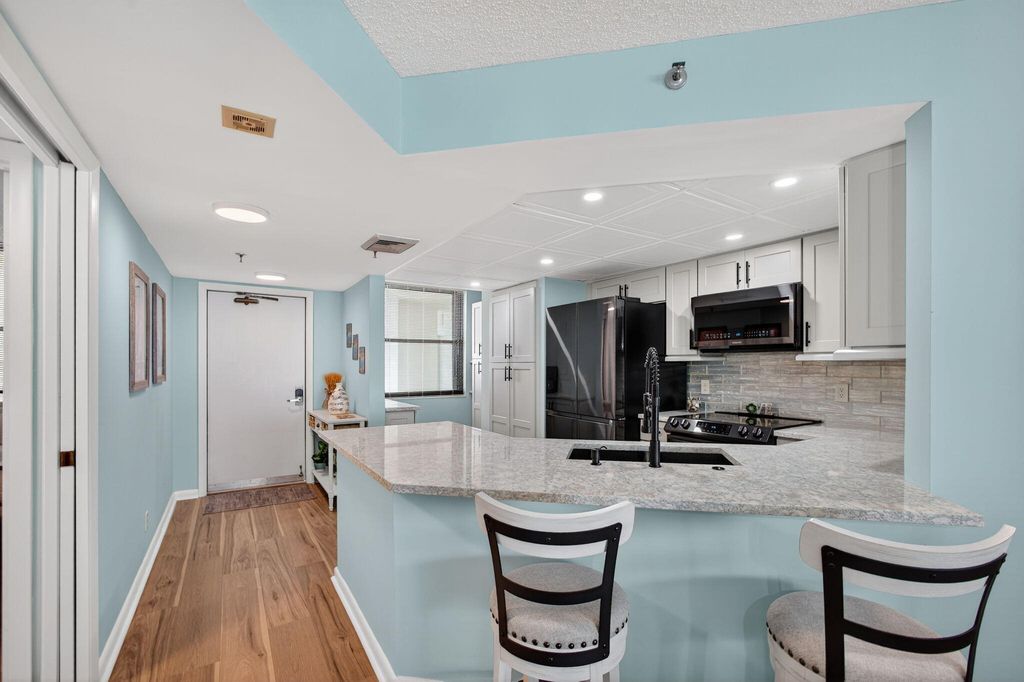 Photo of 9650 S Ocean Drive #302, Jensen Beach, FL 34957 (MLS # B26005944)