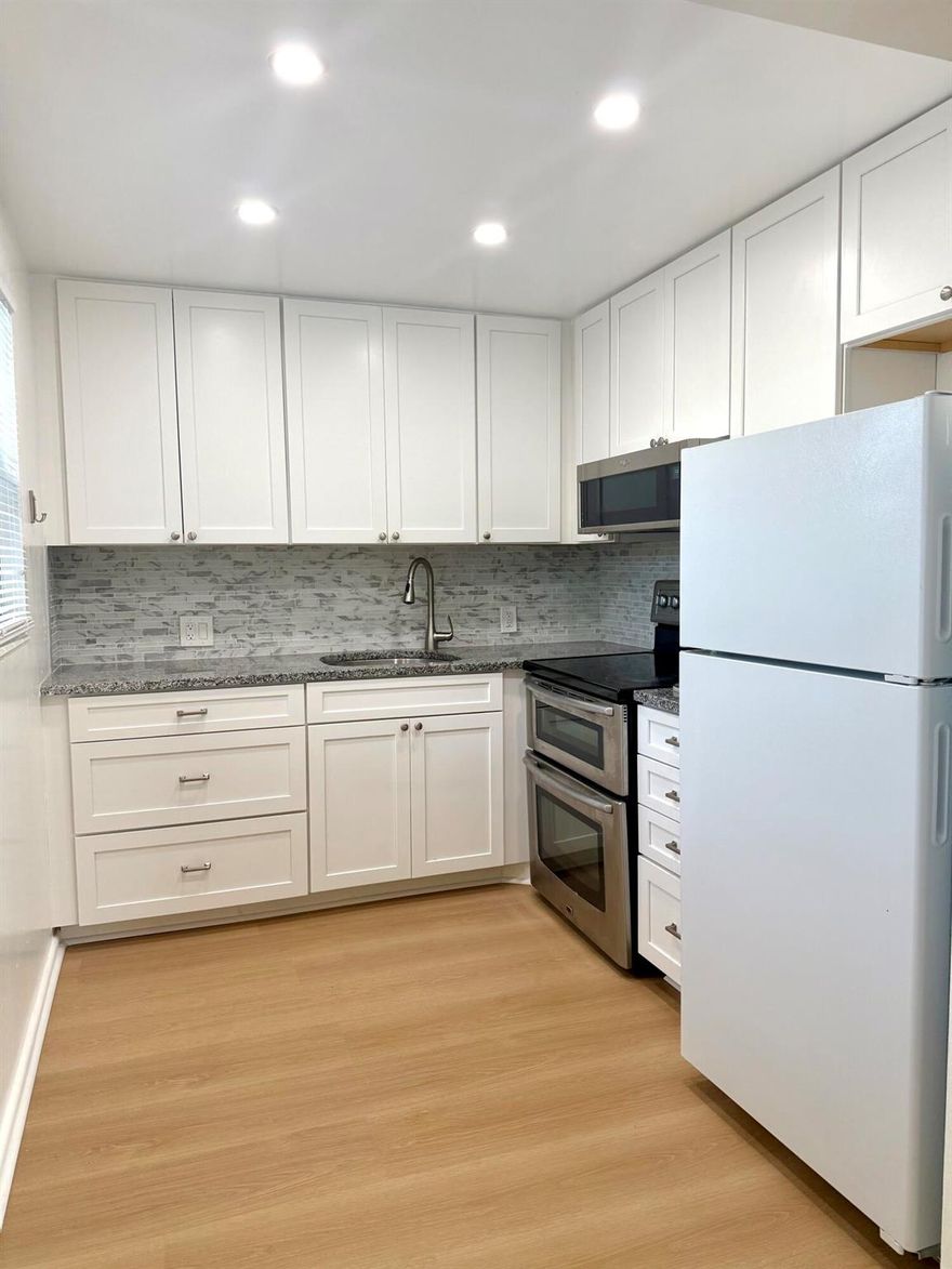 Beautiful and fully renovated 2nd floor unit, conveniently located near the elevator and stairs, offering peaceful garden, parking, and lake views. This updated condo is move-in ready, featuring 2 bedrooms and 1.5 bathrooms within a well-maintained 55+ community. Renovated kitchen with large white cabinets and granite countertops.Ideally situated within walking distance to the house of worship and the pool, and just steps away from the bus stop, clubhouse, parking, and additional amenities. Cable and water are included in the rent.Residents enjoy full access to a spacious clubhouse with numerous activities and social groups. Shuttle service is also available. The unit includes partial impact windows, providing added comfort and peace of mind. Extra storage is available.
