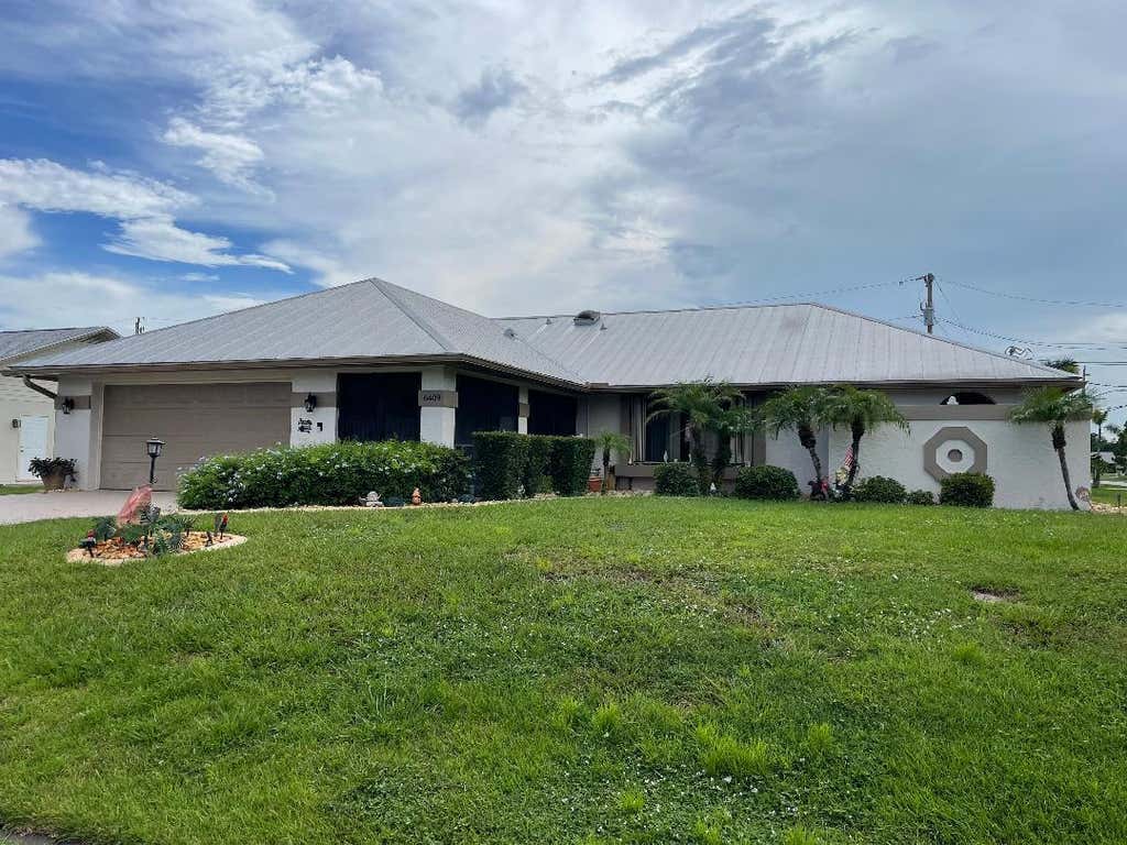 Photo of 6409 NW FRIENDLY Circle, Port Saint Lucie, FL 34983 (MLS # B26058115)