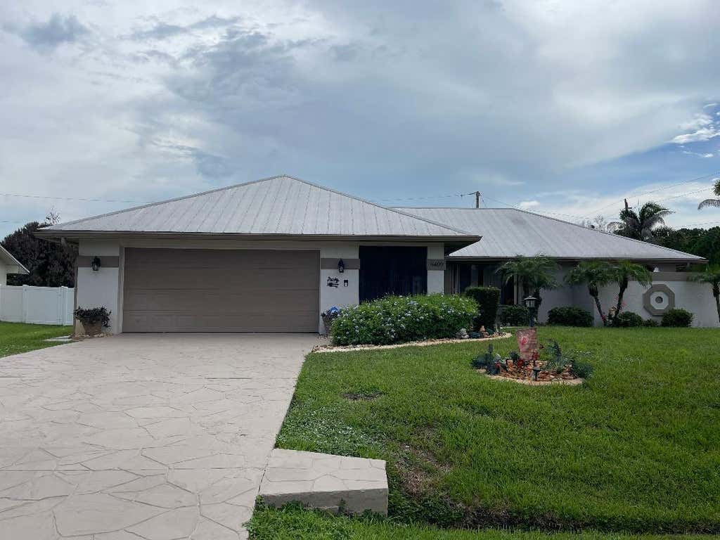 Photo of 6409 NW FRIENDLY Circle, Port Saint Lucie, FL 34983 (MLS # B26058115)