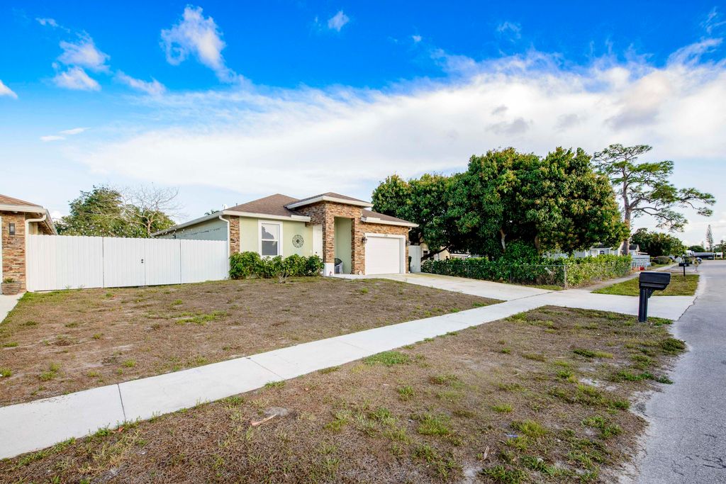 Photo of 128 Broward Avenue, Greenacres, FL 33463 (MLS # R11169119)