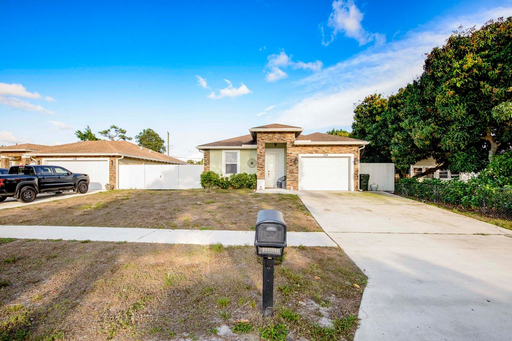 Photo of 128 Broward Avenue, Greenacres, FL 33463 (MLS # R11169119)