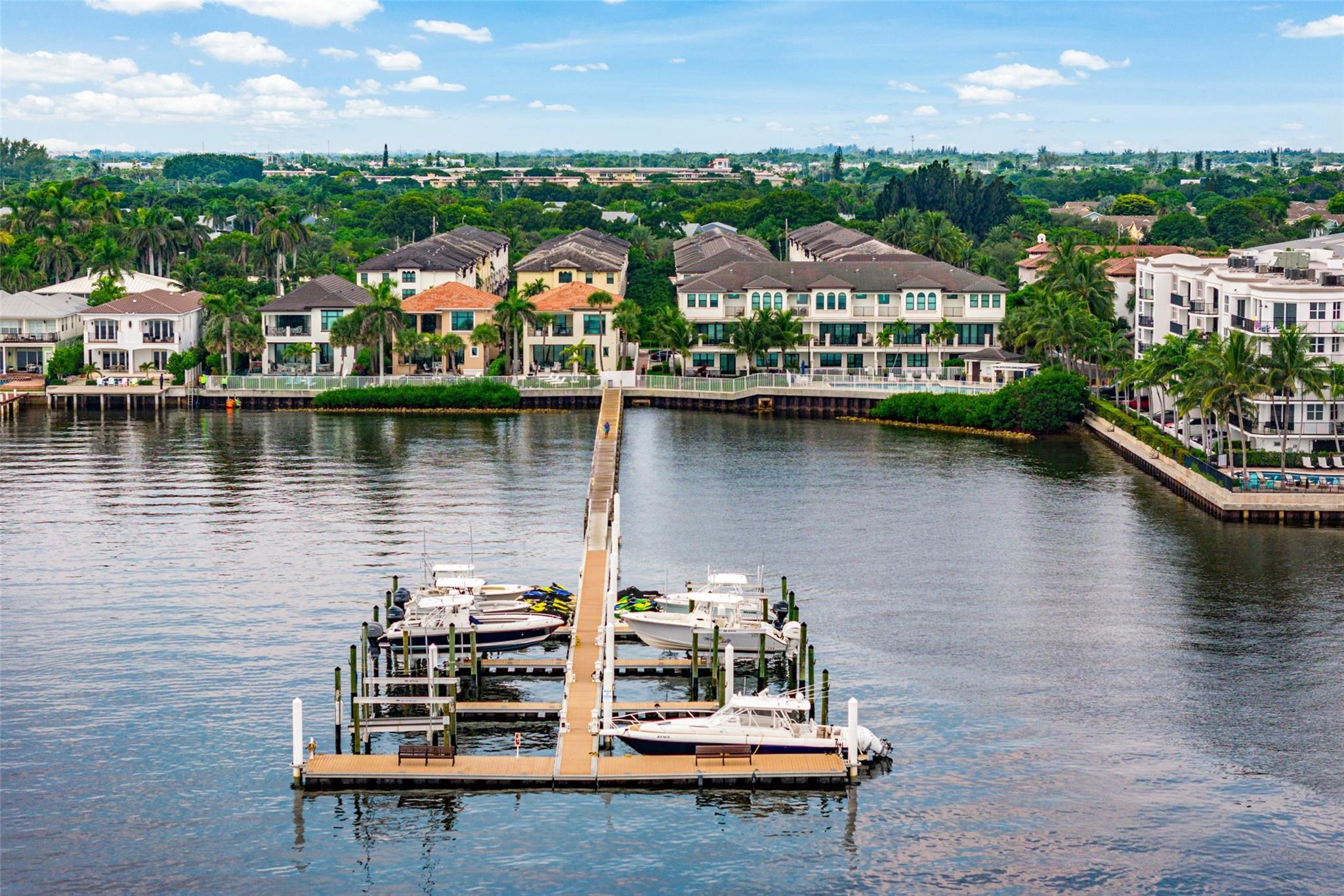 Discover the epitome of luxury living in East Boynton's exclusive Intracoastal enclave, Casa Del Mar. This elegant, tri-level townhome spans an impressive 3,294 total sq. ft. of thoughtfully designed living space, featuring 3 spacious bedrooms, 2 full/2 half baths, and a 2-car garage with additional storage. Every detail has been meticulously crafted to deliver modern comfort, style, and sophistication. Luxury living on three floors with tropical views. Step into the first floor, where a versatile bonus room with a private bathroom awaits. Ideal for a home office, guest suite, or media room, this space offers privacy and functionality to suit your lifestyle needs. The second level showcases a bright, open-concept living area with soaring ceilings and refined finishes.