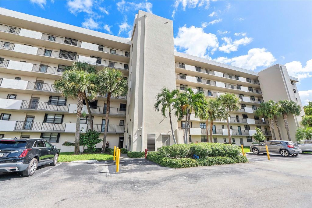 Photo of 2430 Deer Creek Country Club Blvd #406, Deerfield Beach, FL 33442 (MLS # F10532296)