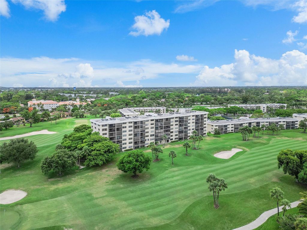 Photo of 2430 Deer Creek Country Club Blvd #406, Deerfield Beach, FL 33442 (MLS # F10532296)
