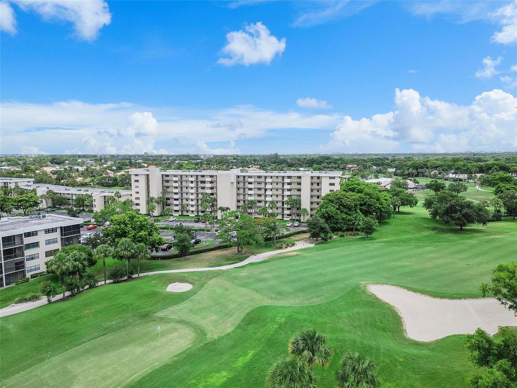 Photo of 2430 Deer Creek Country Club Blvd #406, Deerfield Beach, FL 33442 (MLS # F10532296)