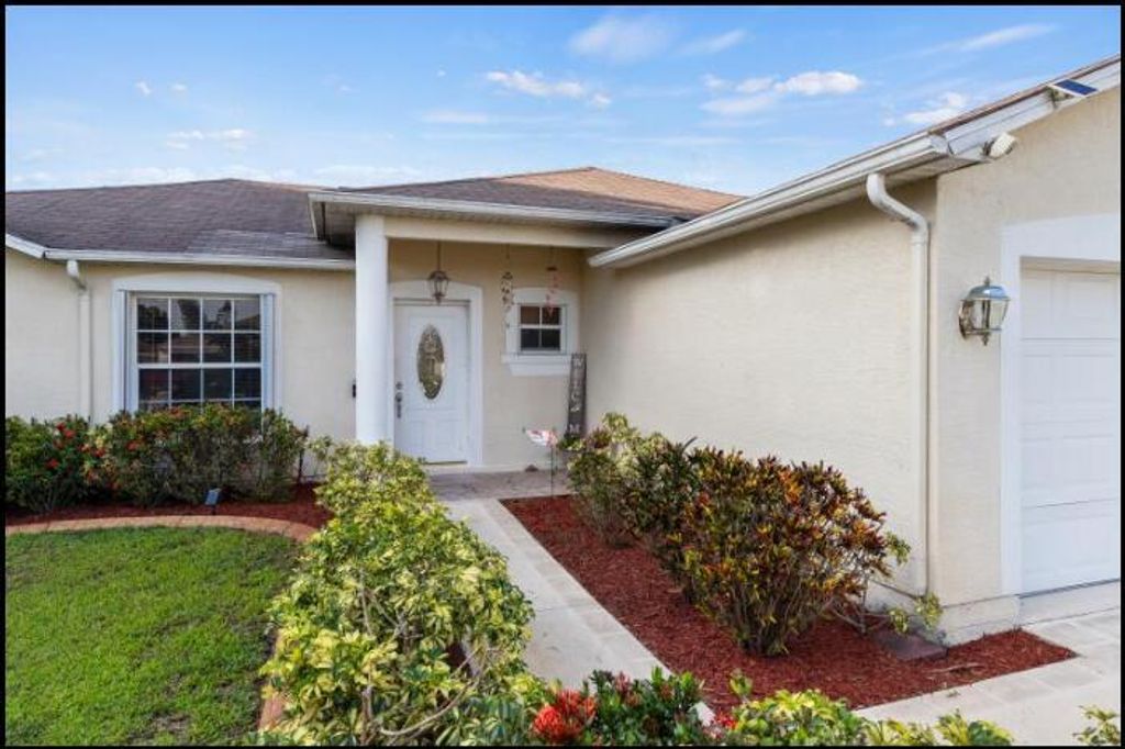 Photo of 391 SW Lacroix Avenue, Port Saint Lucie, FL 34953 (MLS # R10991827)
