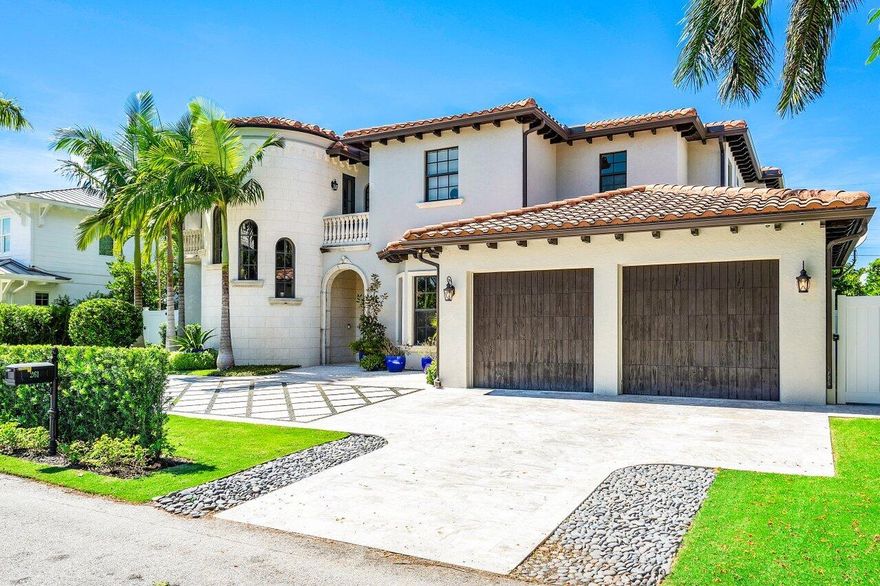 Palm Beach living at its finest! This spectacular estate home is on the exclusive Palmetto Ln Intracoastal block of the highly sought-after South End neighborhood AKA 'SOSO'. Enter this sun-drenched home to soaring ceilings overlooking a custom saltwater LAP POOL with spa. The two-car garage conveniently opens into a mudroom and beautiful custom chef's kitchen. Enjoy the best of indoor/outdoor living in the heart of West Palm Beach. A covered loggia overlooking the pool with an outdoor kitchen and putting green make this home perfect for entertaining and enjoying family and friends. First floor bedroom with ensuite bath, family room, dining room and gorgeous fireplace in the living room flanked by French doors to a spacious light and bright home office - this home has it all!