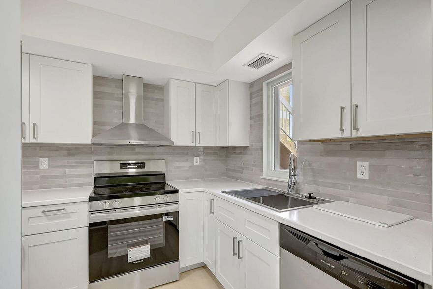 Renovated ground-floor condo with concrete block construction, impact glass, and a 2022 roof. The interior was taken down and rebuilt with all new drywall, luxury vinyl planking (waterproof flooring), doors, trim, lighting, and modern finishes throughout. Brand-new kitchen with soft-close cabinets, stainless appliances, Corian counters, tiled backsplash, and deep sink. Both bathrooms completely redone with new tile, vanities, and Delta fixtures. Screened porch with tropical landscaping. Community offers pool, clubhouse, exterior maintenance, low monthly fees, and is pet-friendly. Centrally located near shopping, dining, and medical.