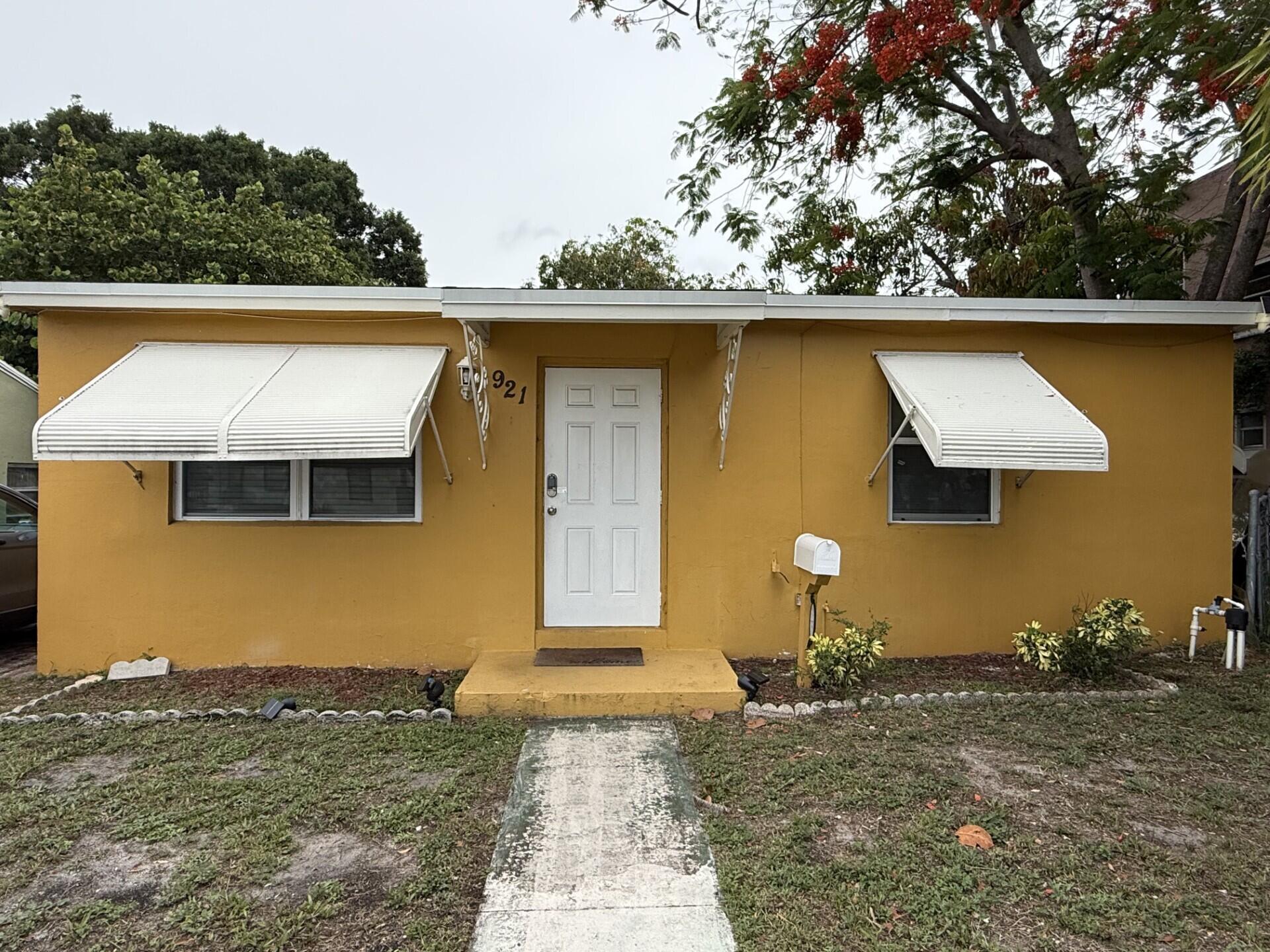 This well constructed CBS 2 bedroom/1 bath home with fully fenced yard is located in historic Northwood Hills, minutes from downtown West Palm Beach. The open floorplan features lots of windows with beautiful natural light, charming, open kitchen concept, and light colored flooring throughout. The big backyard offers plenty of space to add a pool, a delicious mango tree, and endless options for creating your personalized, tropical oasis. The newer roof (2023), termite bond, interior laundry room, and electrical updates make this home a great value. This is a unique opportunity to own a single-family home at an affordable price in a neighborhood where property values are still on the rise! 10 minutes to the ocean or airport. No HOA.
