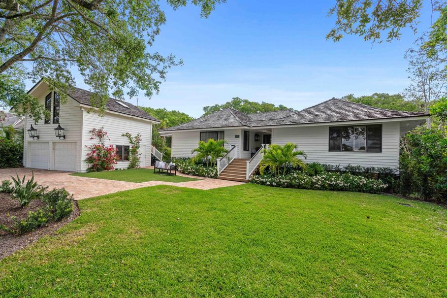 The Hammock House is a unique and special style home at Loblolly.  Tucked away in a natural hammock, this 4B/4BA home promotes an atmosphere of casual costal living as it's best. From the moment you arrive, you are welcomed by large planked wood floors that echo warmth and character and custom furnishings and decor that invite. French and sliding doors that open to the expansive wrap-around decking offers a variety of settings to sit outdoors. The large Great Room looks out to the back deck and enclosed screened porch with vaulted ceilings. The Chef inspired kitchen is ideal for cooking up some fun, featuring a luxury French range, quartzite countertops and an adjoining casual seating area with natural views and access to the deck. The spacious master suite is a truly luxurious getaway