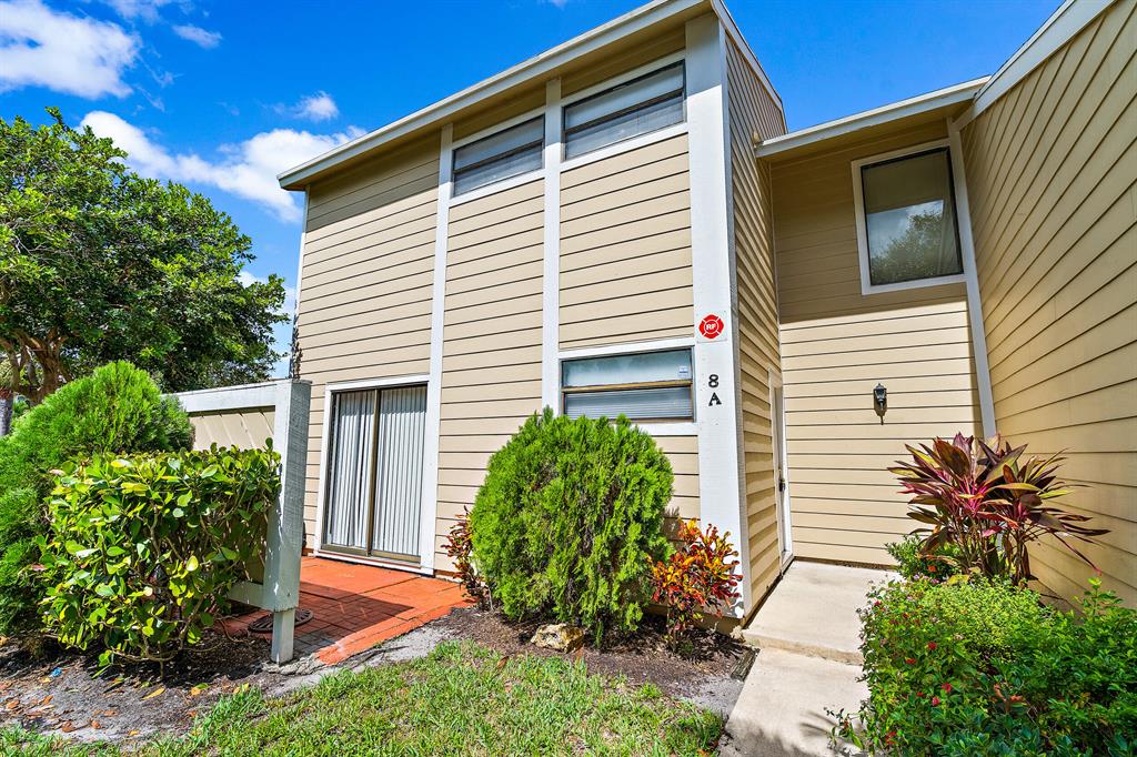 Beautiful end unit located in the heart of Jupiter close proximity to I-95 and the turnpike, and all major shopping. This lovely two bed two and half bath features living quarters upstairs with huge master bedroom dual walk in closets, and updated baths. Downstairs showcases a living room, dinning room, half bath, kitchen and laundry. Freshly painted inside and nice screened patio with yard space and lush landscaping at the front entrance. Plenty of parking right in front (2) assigned spots and (1) guest spot right outside the front door. Private patio off the kitchen perfect for morning coffee or grilling.