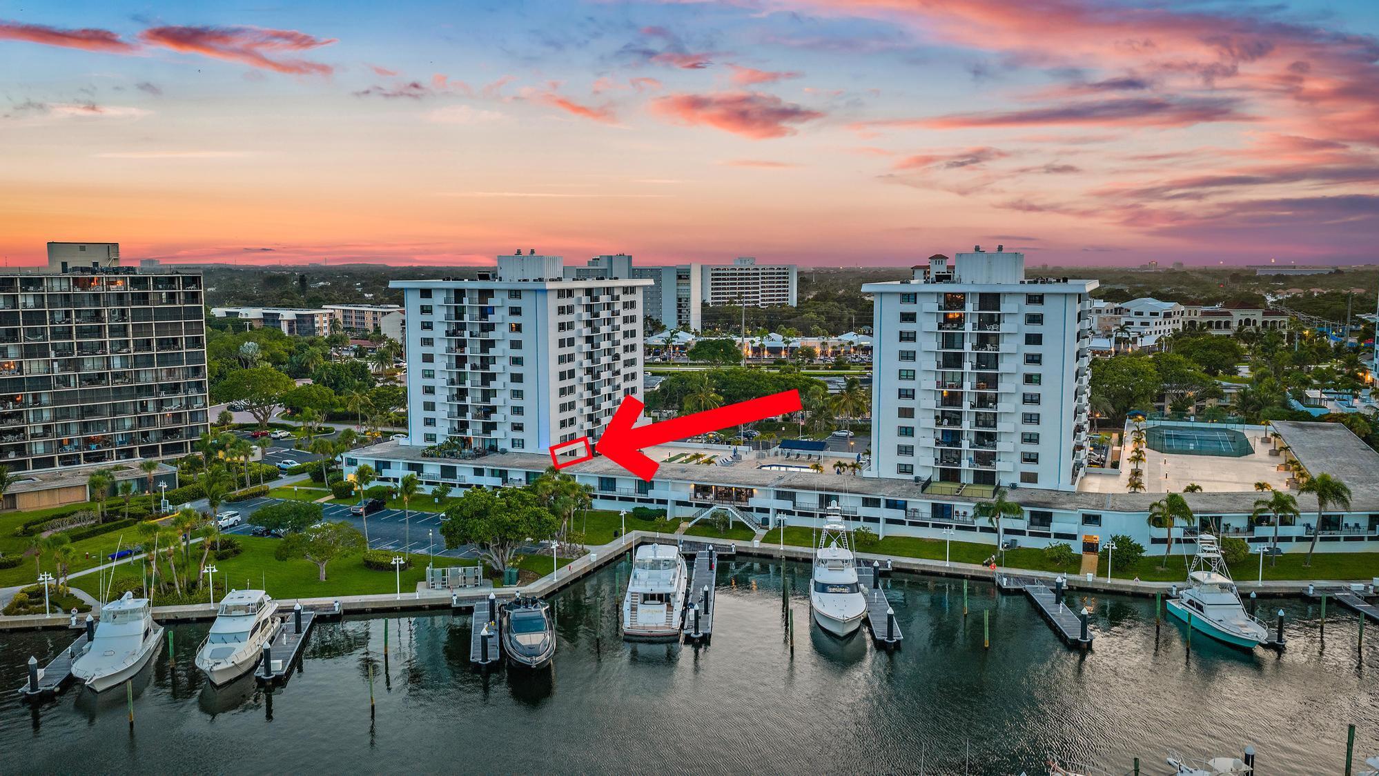 Located in the desirable, gated waterfront community of Old Port Cove in North Palm Beach, this deck-level condo offers a true marina lifestyle just steps from shops, dining, and the Intracoastal. Ideally situated on the deck-level, this residence offers rare walk-out access to the shuffleboard and pool deck, giving it the ambiance of a private villa rather than a typical condo. Originally designed as a studio, the home has been converted into a one-bedroom, 1 bathroom, den or office and walk-in closet with updated vinyl wood flooring throughout. The kitchen has been beautifully renovated with stainless steel Samsung appliances and modern finishes, while the dining area flows seamlessly into the living room.