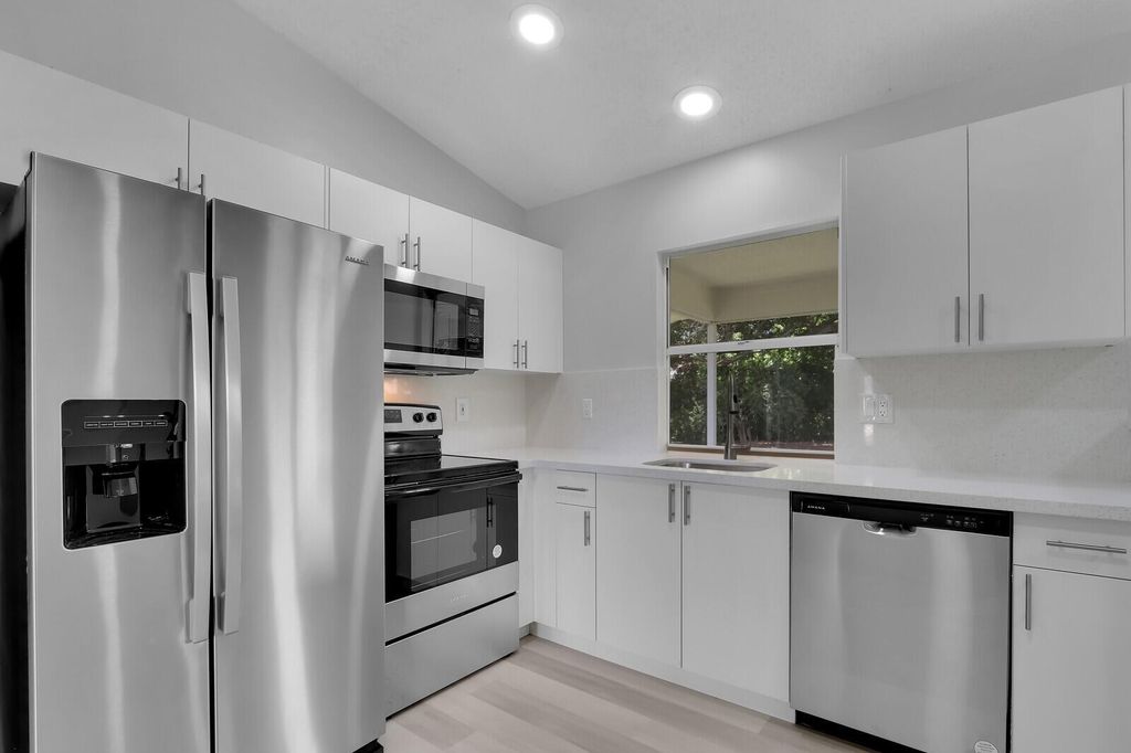 Photo of 1938 SW Cycle Street, Port Saint Lucie, FL 34953 (MLS # R11008192)