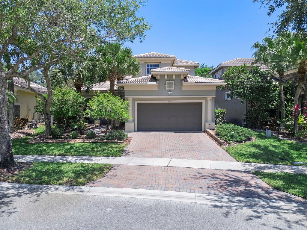 Photo of 12341 NW 78th Manor, Parkland, FL 33076 (MLS # R11092499)