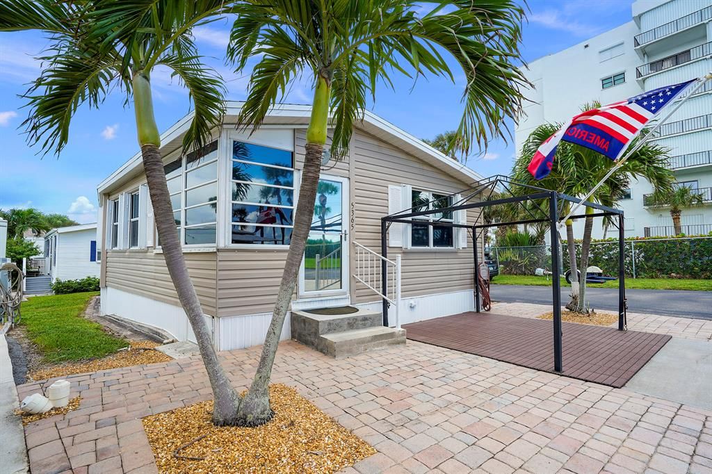 Photo of 5365 Compass Cove Place, Hutchinson Island, FL 34949 (MLS # R10662344)