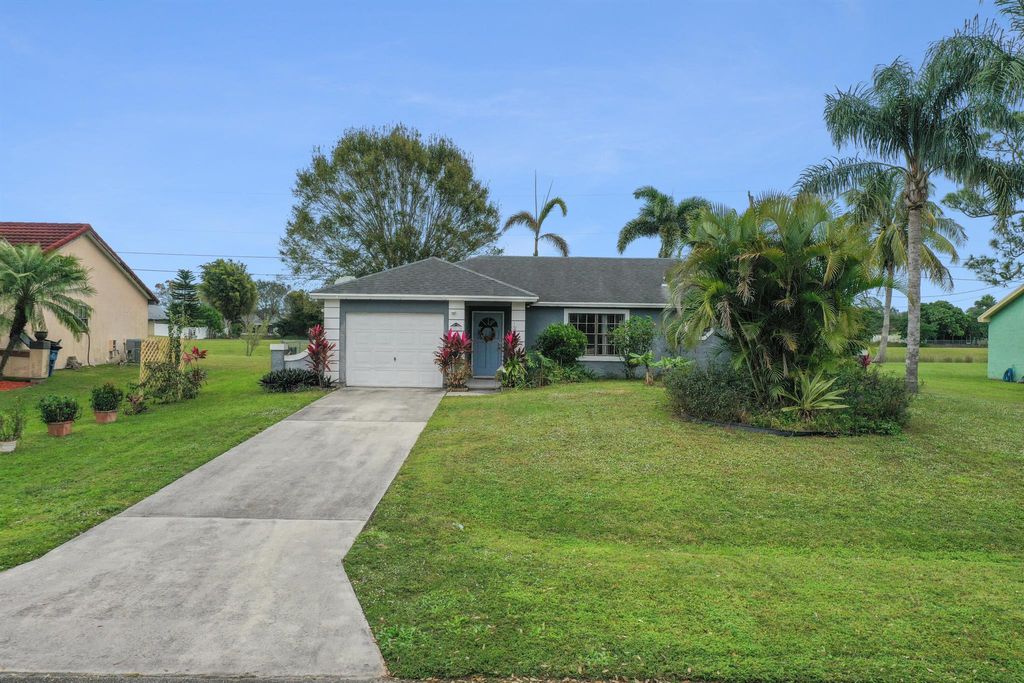 Photo of 2817 SW Pierson Road, Port Saint Lucie, FL 34953 (MLS # R10948792)