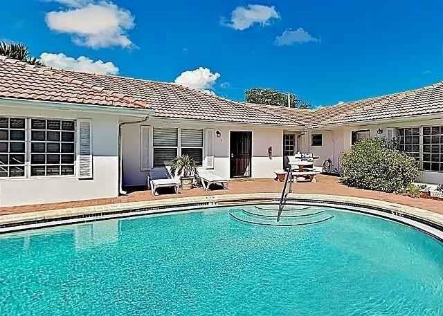 Beauti Great location with a pool and patio and only 1 block walking distance to the wide beach. Close to restaurants and shopping a supper location close to but without all the Housel and Bussel of the commercial locations. See Broker Remarks for links to Units 1 & 3 Furnished Units Annual or short term