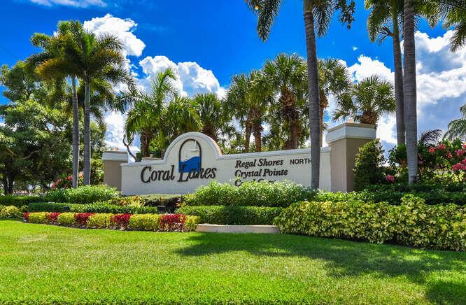 Welcome to beautiful Coral Cove to this spacious ground floor condominium where you can enjoy your relaxing outdoor on your lakefront patio, A very large primary bedroom with sitting area, an overabundance of closets & storage space throughout the home, a laundry room with deep sink & much more provide excellent value! Large storage closet, community pool, tennis & pickleball close by. Clubhouse with cafe, theatre, indoor & outdoor pools, library and much more for you to enjoy!