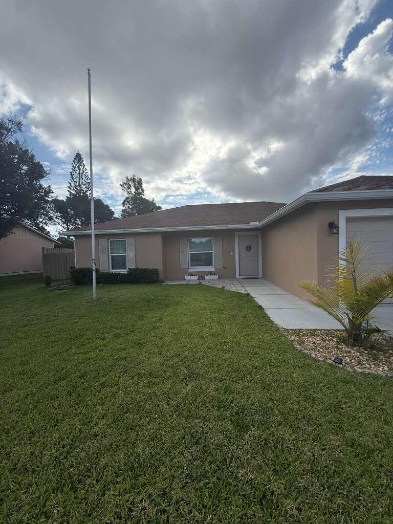 Photo of 349 NW Hibiscus Street, Port Saint Lucie, FL 34983 (MLS # B26038047)