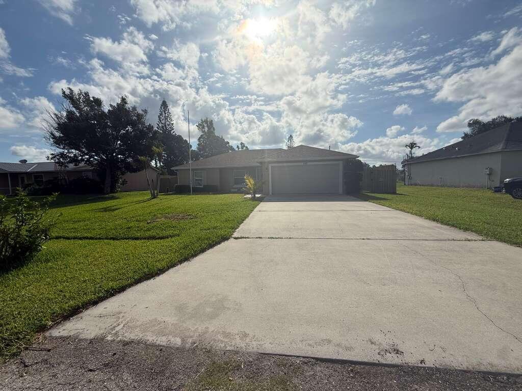 Photo of 349 NW Hibiscus Street, Port Saint Lucie, FL 34983 (MLS # B26038047)
