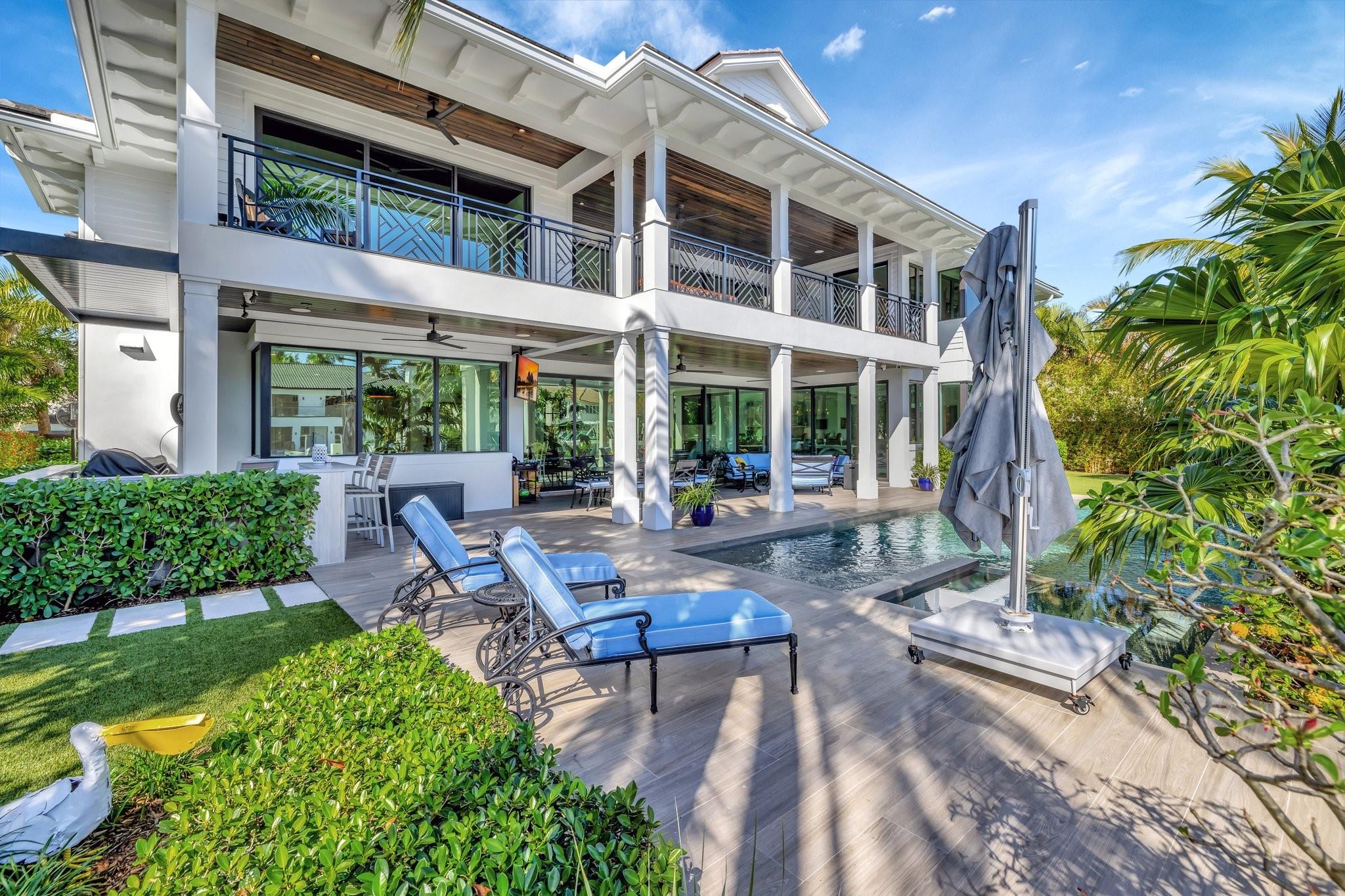 One of the best values for newer construction on Las Olas, at just $1,386 a square foot! British West Indies architecture with a modern edge, this 2021 Gulf Builders home stands out on Las Olas Isles. With 100 feet of deep-water frontage, a boat lift, floating dock, and no fixed bridges, it is great for boaters. The main living area centers around a sleek fireplace and flows into an entertainment lounge with full bar. A chef’s kitchen, oversized island, and butler’s pantry make hosting a breeze. The primary suite offers dual baths and closets, while four additional ensuite guest rooms provide comfort and privacy. Includes nine baths, two laundry rooms, a three-car garage, and Crestron automation. This home delivers the design, scale, and location rarely found together on the Isles.