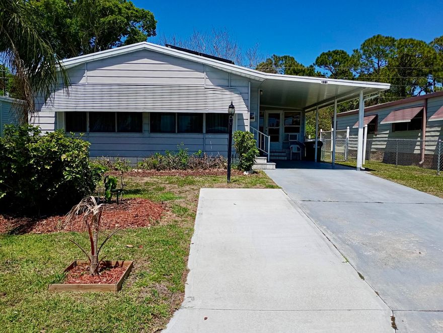 An above ground hot tub and a deck makes this charming 2BR/2BA solar home in Barefoot bay, combine comfortable living with an active country- club lifestyle without mandatory membership. This well-maintained home offers a spacious lay out plus a versatile Florida room perfect for an office, hobby space or guest overflow. The bright kitchen features sleek stainless steel appliances ample cabinetry, and a convenient bar area perfect for entertaining. The primary suite boasts a double-sink vanity, soaking tub and separate shower while guest bath includes a tub/shower combo. A deck, above ground hot tub and fenced yard enhance outdoor living . Roof is 2024, Water Heater is 2022. An additional room serves as laundry room and storage for tools. It also has a carport for convenience Residents enjoy a clubhouse with the 19th Hole restaurant pools,tennis and pickelball courts, shuffleboard, bocce, basketball, mini golf,a 776-foot fishing pier, private beach access, hobby clubs and leagues and nearby shopping and dining-all contributing to the ultimate relaxed Florida lifestyle. this house is also equipped with solar panels for added convenience.Call now fpr a private tour your Florida home is waiting!