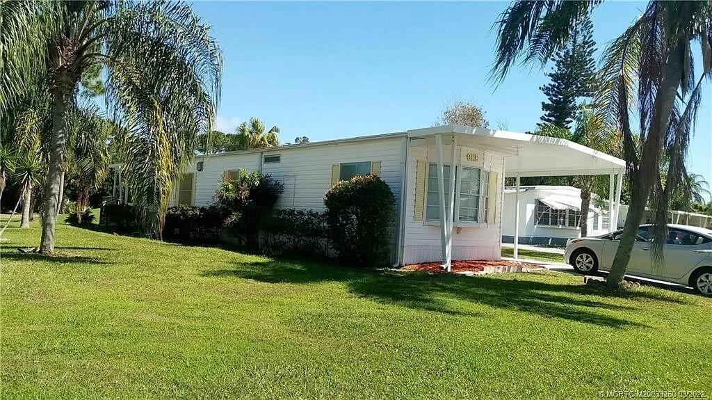 This two bedroom two bath manufactured home in a 55 and older community is a beautiful well maintained manufactured home in a cozy cul-de-sac also on the golf course and view also golf course view directly across from community pool tennis and clubhouse. This house also has a private wooden deck which has a nice open-air breeze overlooking golf course good place to sit outside and barbecue .This home is equipped with new kitchen new water heater new lamps countertops new toilets upgraded bathroom window dressing freshly painted Air conditioner is only 8 years old roof has been inspected and there was no damages Market rent (new owner): $1,027.59 a month for 12 months.