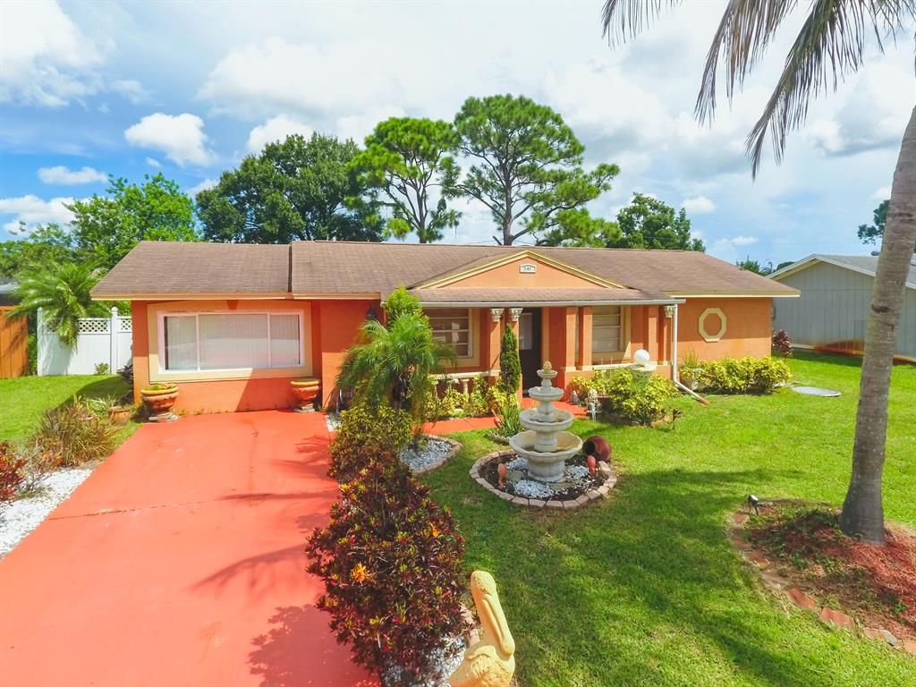 Photo of 541 SW Comet Terrace Ter, Port St Lucie, FL 34953 (MLS # R10828461)