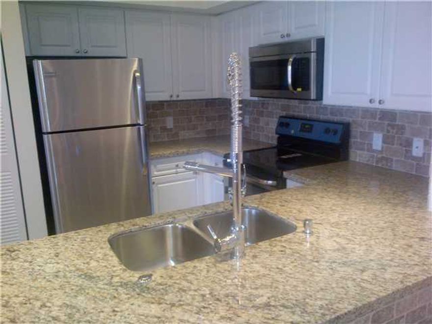 AT BOATERS BUILDING FACING INTRACOASTAL & JUST STEPS AWAY TO CLUB HOUSE & MAIN POOL. TASTEFULLY & COMPLETELY UPGRADED UNIT WITH GRANITE COUNTERTOPS, STAINLESS STEEL APPLIANCES, TILE BACKSPLASH, JACUZZI TUB IN BOTH BATHS! TILE & LAMINATE WOOD FLOORS. STABLE OWNER PURCHASED UNITS CASH TO RENT IT OUT. OWNER DID NOT SPARE ON UPGRADES. MUST SEE TO APPRECIATE! *** MLS PICTURES ARE FROM PRIOR TO CURRENT TENANT'S OCCUPANCY***AVAILABLE FOR SEP 2 MOVE-IN.