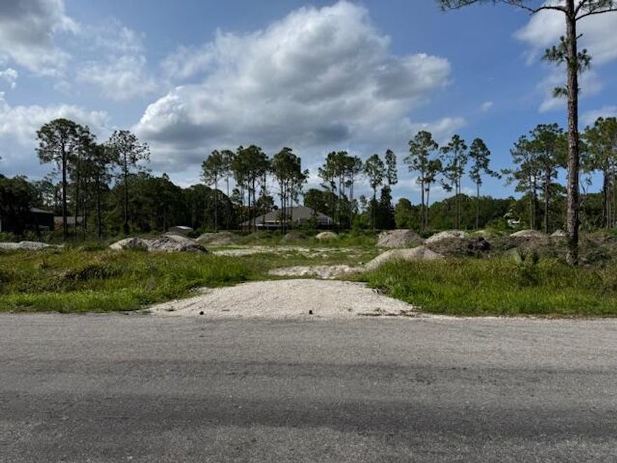 Lot ready to build on paved road in the acreage! 1.60 Acres, cleared lot with fill for building and site. Permit and permit set of drawings available. Available to build ASAP! See Attached