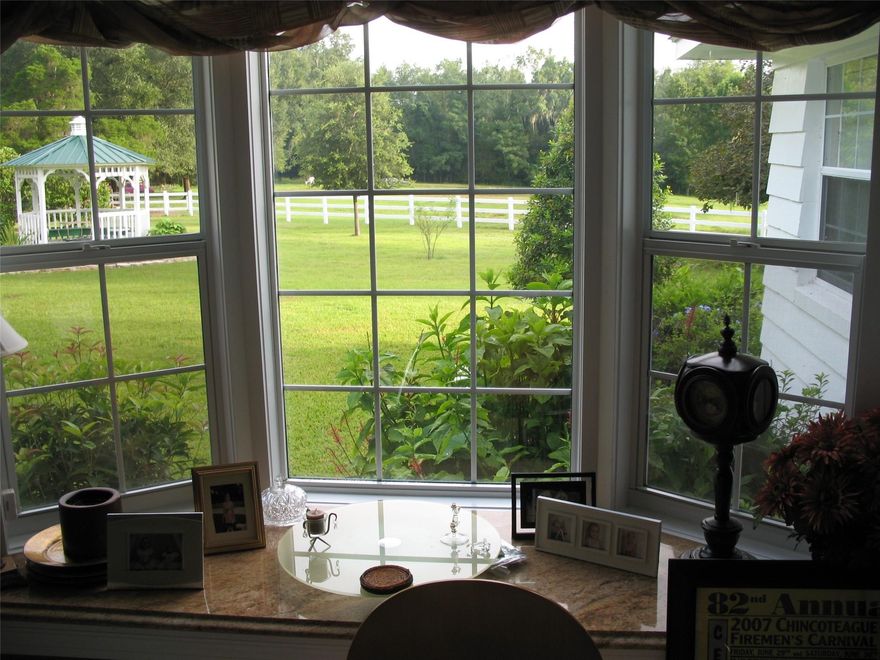 SQUARE FEET 4,279 EQUALS BOTH HOUSES ON MARON COUNTY RECORDS. Discover Your Dream Equestrian Retreat at Magnificent Magnolia Manor! Step into the enchanting Magnificent Magnolia Manor, where your equestrian dreams await! Nestled in the heart of the horse capital of the world, this stunning estate boasts 6.2 meticulously manicured acres, just 3 miles from scenic horse trails and a mere 15 minutes to the prestigious World Equestrian Center. The main house features an inviting upstairs primary suite with a luxurious suite bath, alongside two spacious bedrooms sharing a bath. The expansive downstairs living area, living room, dining room, 4th bed room on ground Floor 3rd bathroom and serene Florida room offer perfect spaces for relaxation.