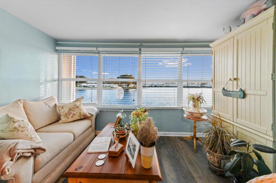 Welcome to Leisureville Lake Condominiums, a desirable 55+ community offering peaceful lakefront living! This charming waterfront condo features 962 sq. ft. of living space with 2 bedrooms and 2 bathrooms, thoughtfully designed for comfort and convenience

Enjoy all the amenities! 18-hole par-3 course, putting green, walking/biking trails, and scenic lakes. Clubhouses, fitness center, sauna/steam room, and heated swimming pools and hot tubs/jacuzzis, numerous social clubs and more!

Step inside to a welcoming foyer that leads to the dining and living areas, seamlessly connected to the kitchen, complete with cabinets for ample storage. Enjoy relaxing in the bright Florida room overlooking the lake, the perfect spot for morning coffee.