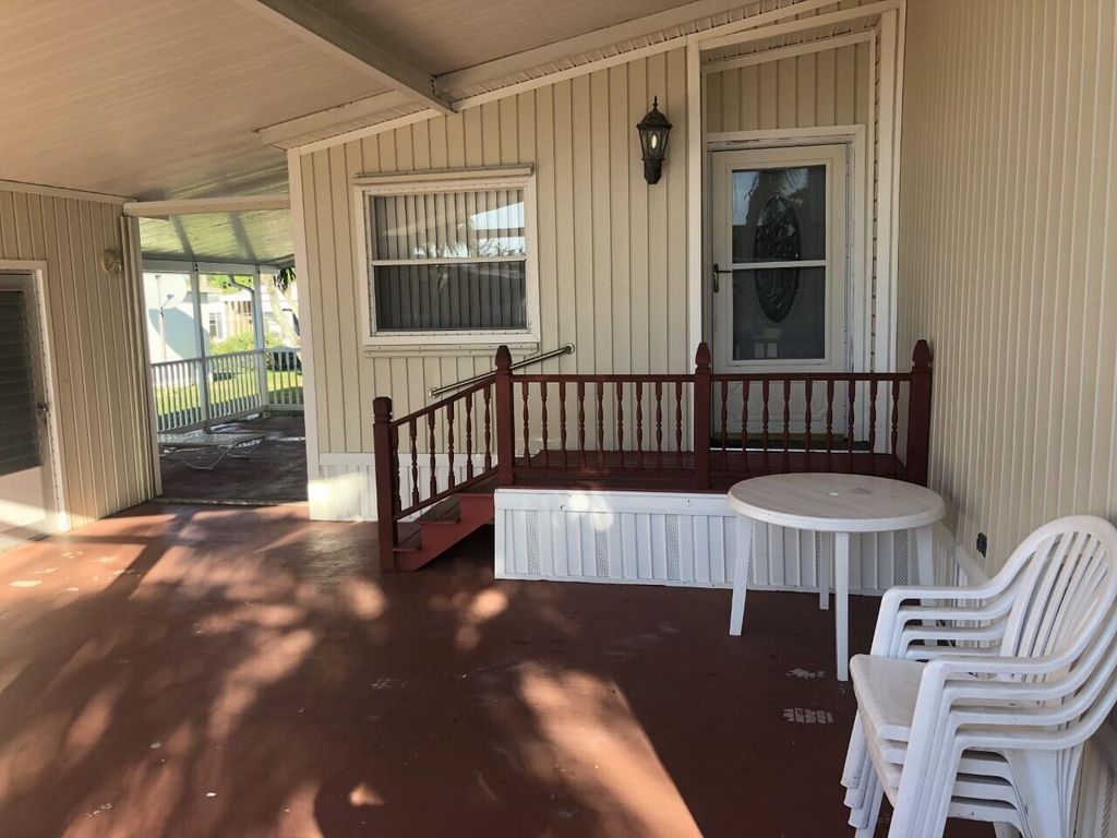 Photo of 7847 SE Swan Avenue, Hobe Sound, FL 33455 (MLS # B26010200)