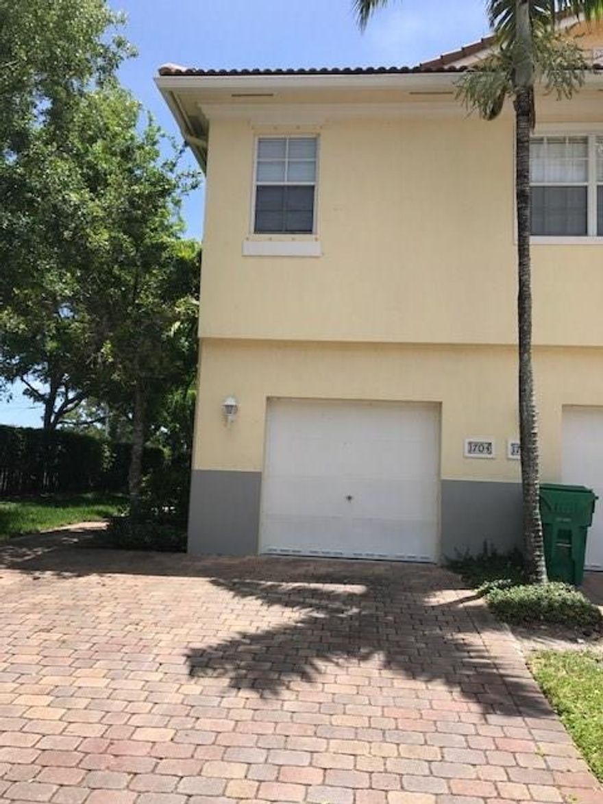 Move right in to this beautiful  3 bed 2.5 bath corner townhome. Unit has a 1 car garage lots of privacy and is located in a  GATED community!!! Kitchen features BRAND NEW stainless steel appliances, granite countertops and wood cabinetry. Newer laminate flooring on stairs and throughout 2nd floor. Community has playground, pool and other great amenities! HOA requires 10% min. down but FHA is approved here!
