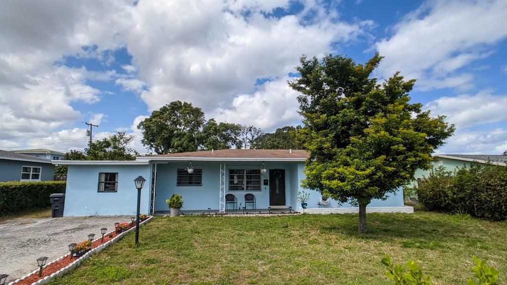 Photo of 623 Date Palm Drive, Lake Park, FL 33403 (MLS # R10705828)