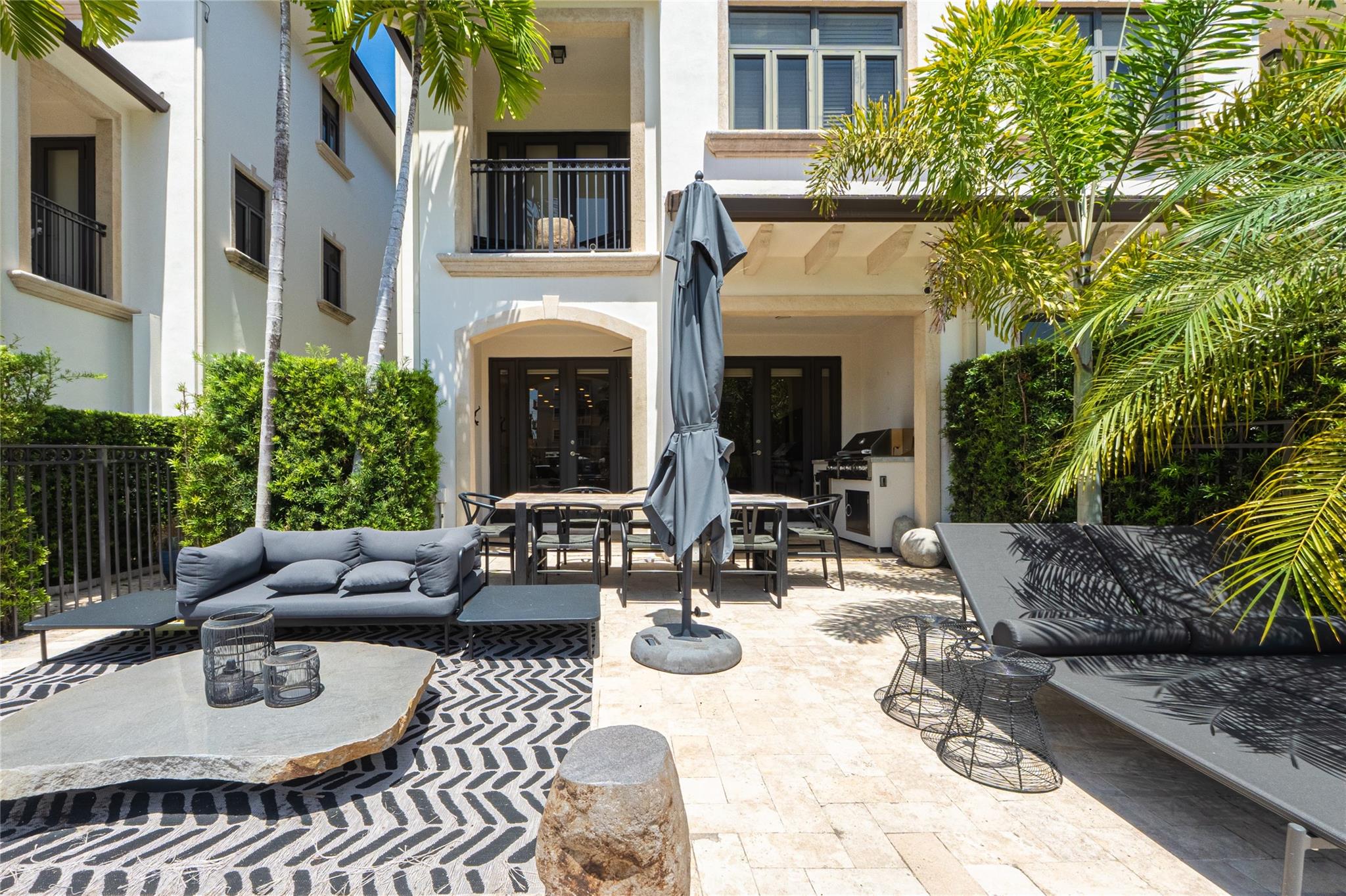 Experience luxury waterfront living in this impeccably maintained, like-new corner townhouse featuring a private boat slip for up to a 50-foot vessel. Soak in breathtaking sunrises & sunsets from every room, each w/ its own private terrace overlooking a wide waterway & the city lights of downtown Ft Lauderdale. This stunning home boasts a private first-floor yard, complete with an outdoor kitchen, lounge area & space to add a pool. Perfect for entertaining or relaxing in your own serene retreat. Located just a short walk to world-renowned Ft Lauderdale Beach, fine dining, boutique shopping & vibrant nightlife. This home offers the ultimate in coastal lifestyle & accessibility. Offered below market value, this rare opportunity combines elegance, convenience, and unbeatable value.