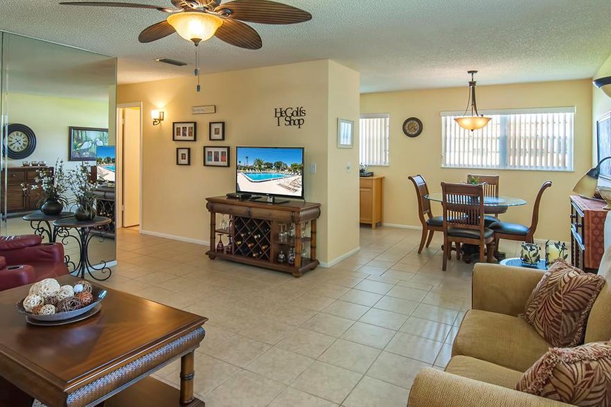 Absolutely Beautiful !!! Move In Ready !!! This 2 / 2 Condo has been updated and meticulously cared for. Incredible views of the golf course, lake, and clubhouse from your enclosed porch. Just a short walk to the pool and other amenities. This condo offers newer appliances, hot water heater, and AC. '' SOLD FURNISHED IF DESIRED. '' Minutes to the beach and nearby shops and restaurants.