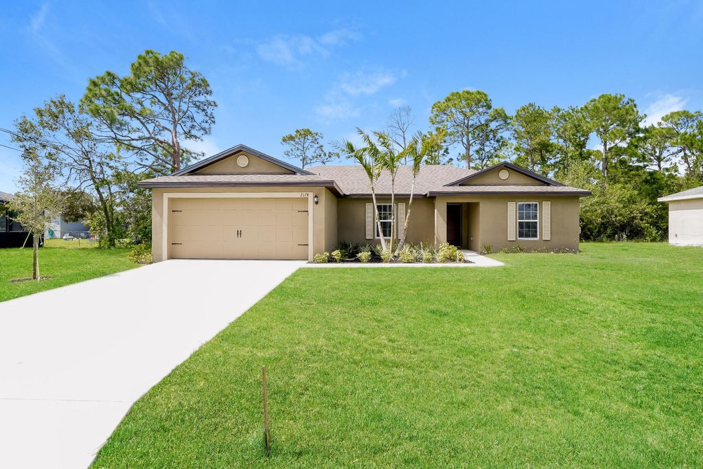 Photo of 2174 SW Wayne Street, Port Saint Lucie, FL 34984 (MLS # B26012055)