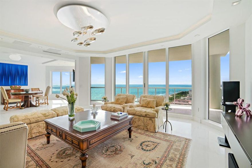 This highly desirable luxury residence boasts unmatched panoramic views of the Ocean, Intracoastal and Palm Beach coastline as far as one can see with 3 spacious terraces to enjoy the morning stunning sunrise and spectacular sunset views. Fabulously renovated this condo offers a private elevator foyer, impact sliding glass doors throughout, impact glass terrace railings, 9 foot feelings, Dolomite White Italian 24 x 24'' marble flooring in the living area, plank Oak Hilo wood floors  in the bedrooms and 24 x 24'' marble in the bathrooms. The kitchen features Dellicasa cabinetry with granite countertops and island, top-of-the-line appliances, and a white quartz waterfall bar top. The residence is being sold with two conveniently located garage parking spaces AND... (See Supplemental...)