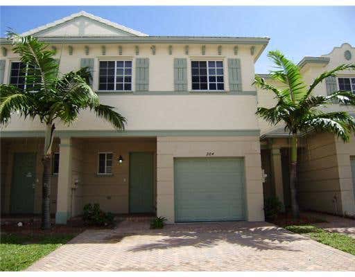 Photo of 969 Tortuga Lane, Riviera Beach, FL 33404 (MLS # B26039415)