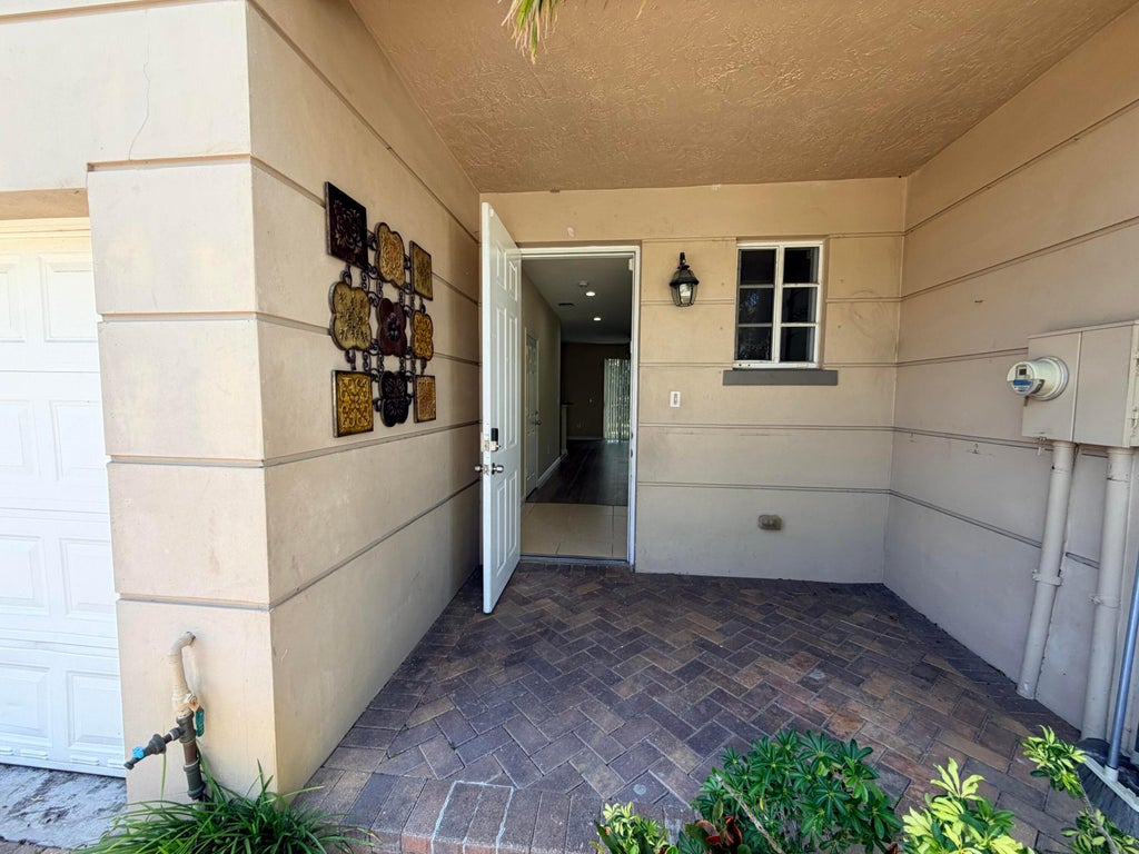 Photo of 969 Tortuga Lane, Riviera Beach, FL 33404 (MLS # B26039415)