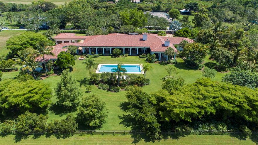 This Gated Spanish Colonial Estate on 2.5+ verdant acres totals 12,114+/- square feet of living space and is comprised of a 2-bedroom/2.1-bath main residence, separate 2-bedroom/2-bath guest quarters, an attached 2-bay garage and a detached 2-bay garage. All artfully designed using exceptional natural materials to complement its decidedly pastoral setting, with every interior space opening to a charming garden or expansive loggia. The end result is a highly stylized, sophisticated residence with a remarkable sense of tranquility and ease. Complete with a full summer kitchen, 20' x 50' pool, private spa, and ample space for a barn and paddocks, this perfectly scaled bespoke estate reflects the consummate skills of Affiniti Architects' Mitch Kunik and Bloomfield Construction's William Hacy.