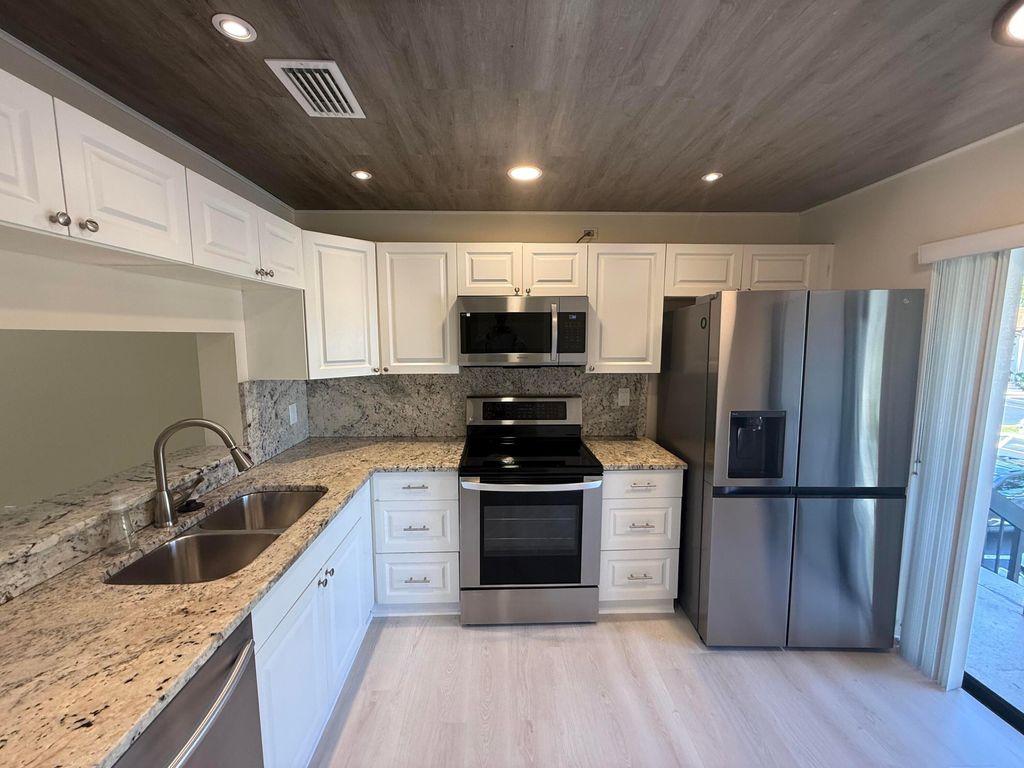 Photo of 5150 E Club Circle #202, Boca Raton, FL 33487 (MLS # B26021324)