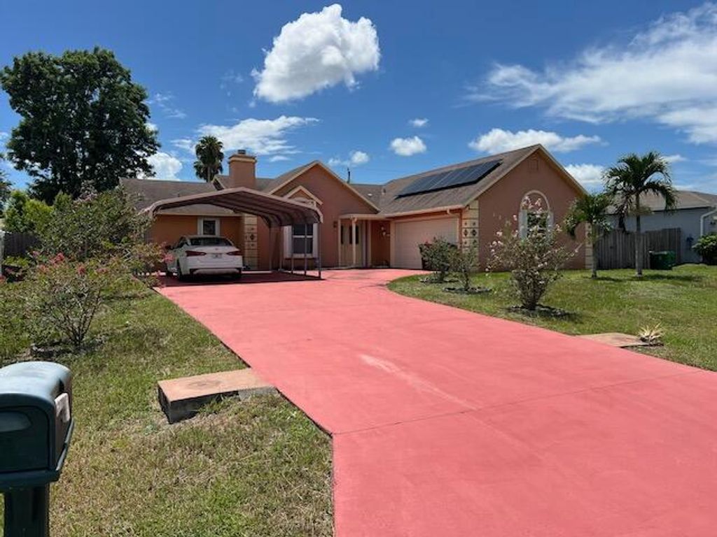 Photo of 822 SW Carmelite Street, Port Saint Lucie, FL 34983 (MLS # R11105428)